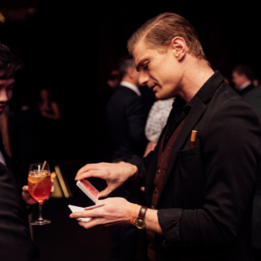 Mr Marmalade performing close-up magic at a corporate function